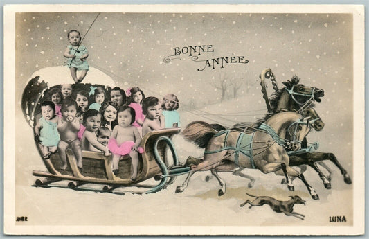 MULTIPLE BABIES in TROYKA HORSE SLED CARRIAGE HAPPY NEW YEAR VINTAGE POSTCARD