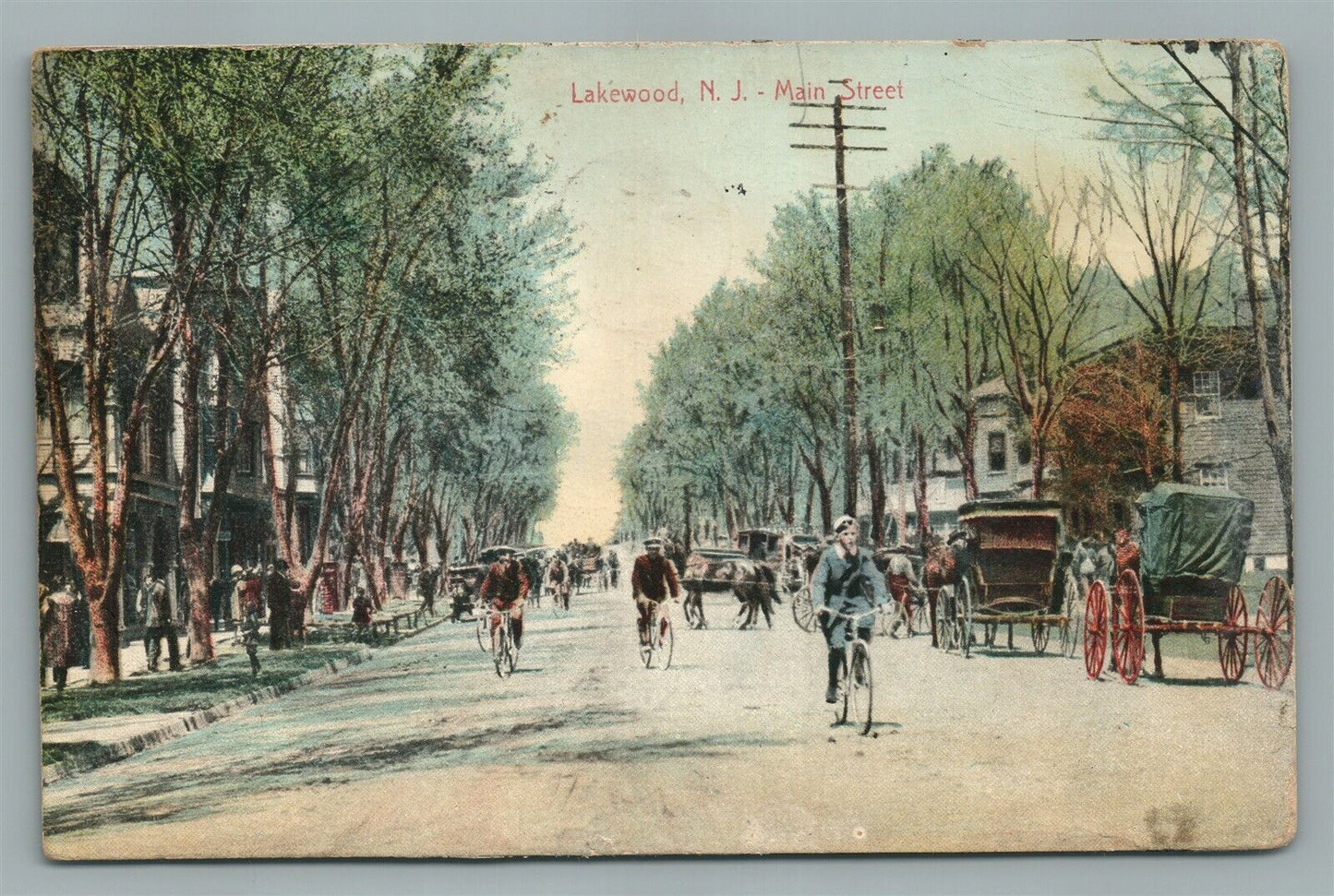 LAKEWOOD NJ MAIN STREET BIKE RIDERS ANTIQUE POSTCARD