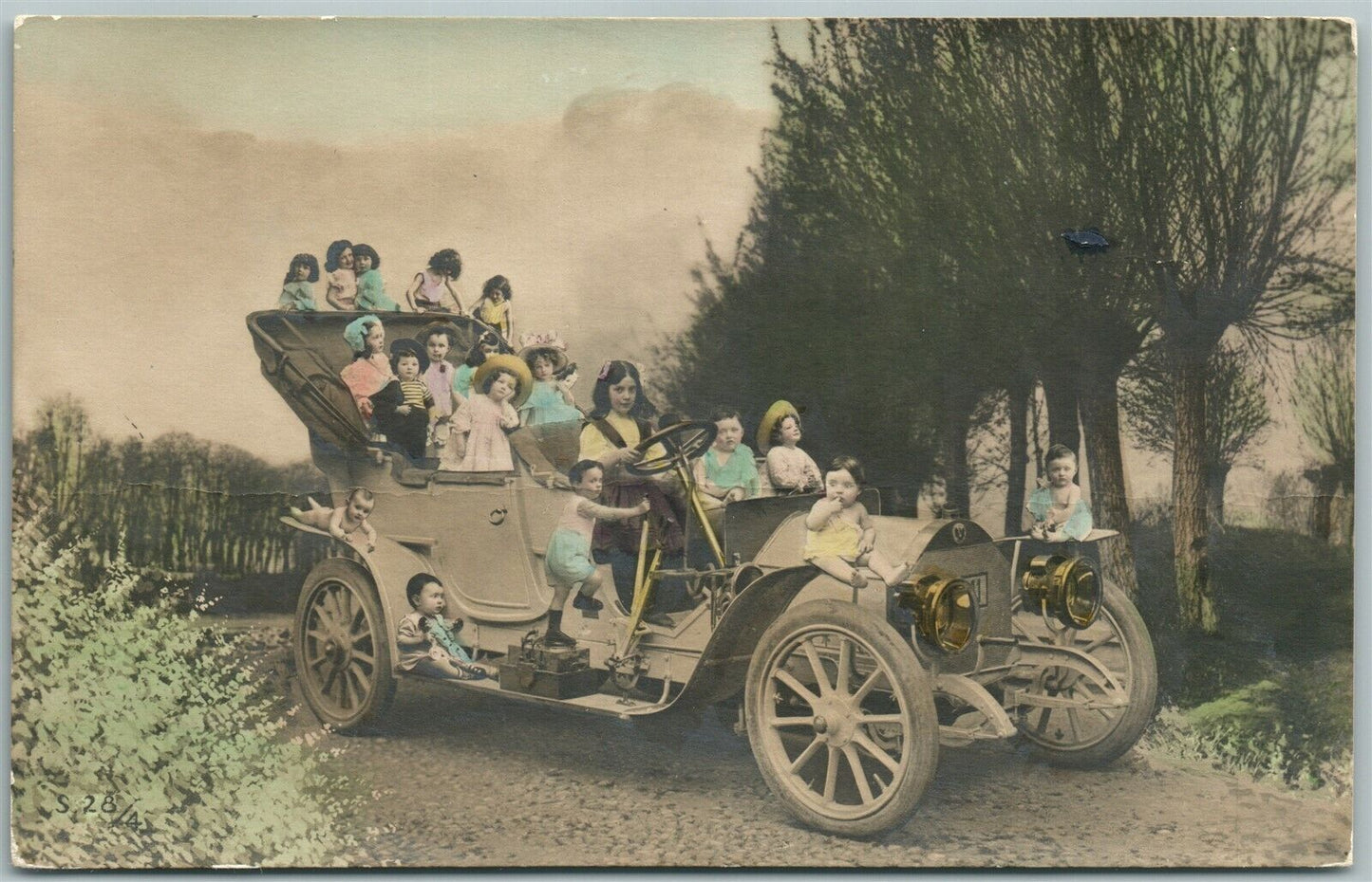 MULTIPLE BABIES DRIVING AUTOMOBILE ANTIQUE POSTCARD