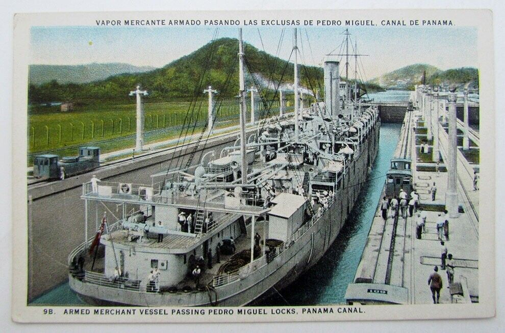 VINTAGE POSTCARD - ARMED MERCHANT VESSEL PASSING PEDRO MIGUEL LOCKS PANAMA CANAL