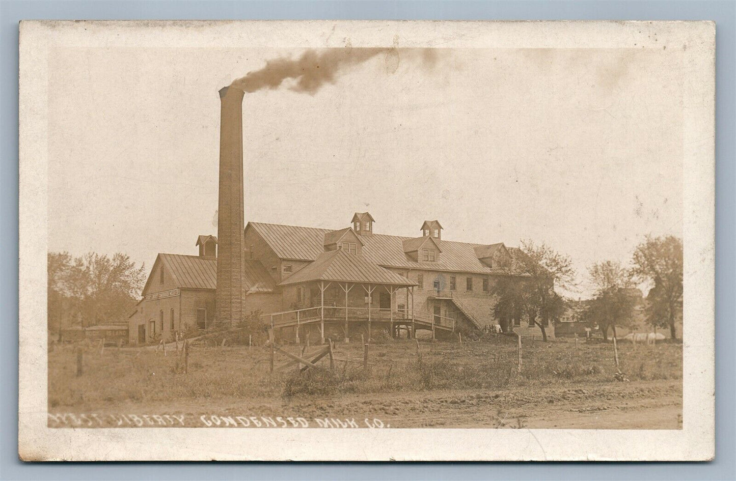 WEST LIBERTY IA CONDENSED MILK COMPANY ANTIQUE REAL PHOTO POSTCARD RPPC