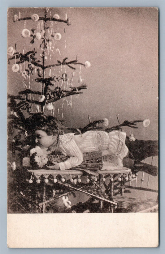 GIRL w/ DOLL under CHRISTMAS TREE w/ ORNAMENTS ANTIQUE POSTCARD NEW YEAR