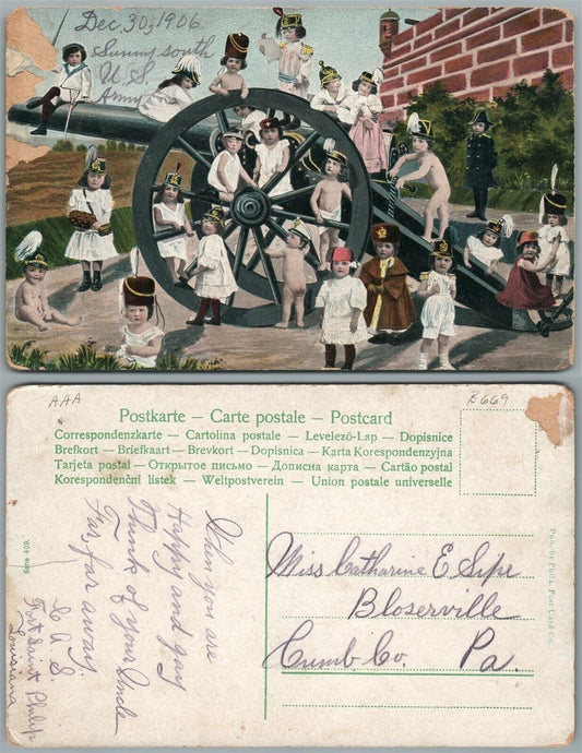 MULTIPLE BABIES MILITARY SCENE w/ CANNON ANTIQUE POSTCARD