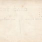 LOCOMOTIVE TRAIN ARRIVES AT RAILROAD STATION ANTIQUE REAL PHOTO POSTCARD RPPC