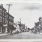 BUSINESS DISTRICT BROAD STREET QUAKERTOWN PA VINTAGE POSTCARD cars store signs