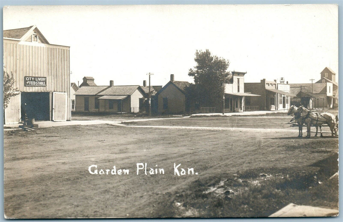 GARDEN PLAIN KS CITY LIVERY & FEED STABLE ANTIQUE REAL PHOTO POSTCARD RPPC