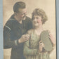 US NAVY SAILOR w/ FIANCEE ANTIQUE HAND COLORED REAL PHOTO POSTCARD RPPC