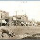 SANBORN IA MAIN STREET SCENE w/ PIG 1912 ANTIQUE PHOTOMONTAGE REAL PHOTO RPPC