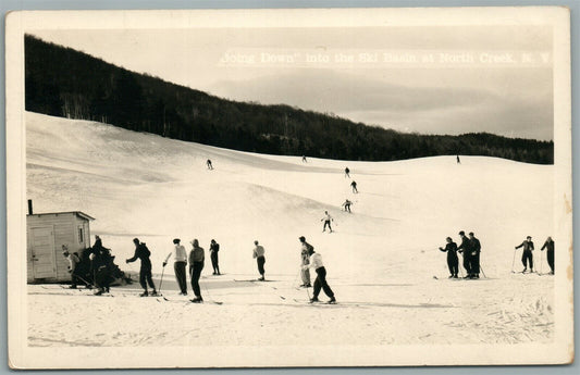 NORTH CREEK NY SKIERS GOING DOWN VINTAGE REAL PHOTO POSTCARD RPPC