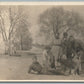 VILLAGE SCENE WITH SOLDIERS & DOGS ANTIQUE REAL PHOTO POSTCARD RPPC