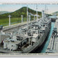VINTAGE POSTCARD - ARMED MERCHANT VESSEL PASSING PEDRO MIGUEL LOCKS PANAMA CANAL