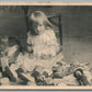 LITTLE GIRL w/ DOLLS ANTIQUE POSTCARD