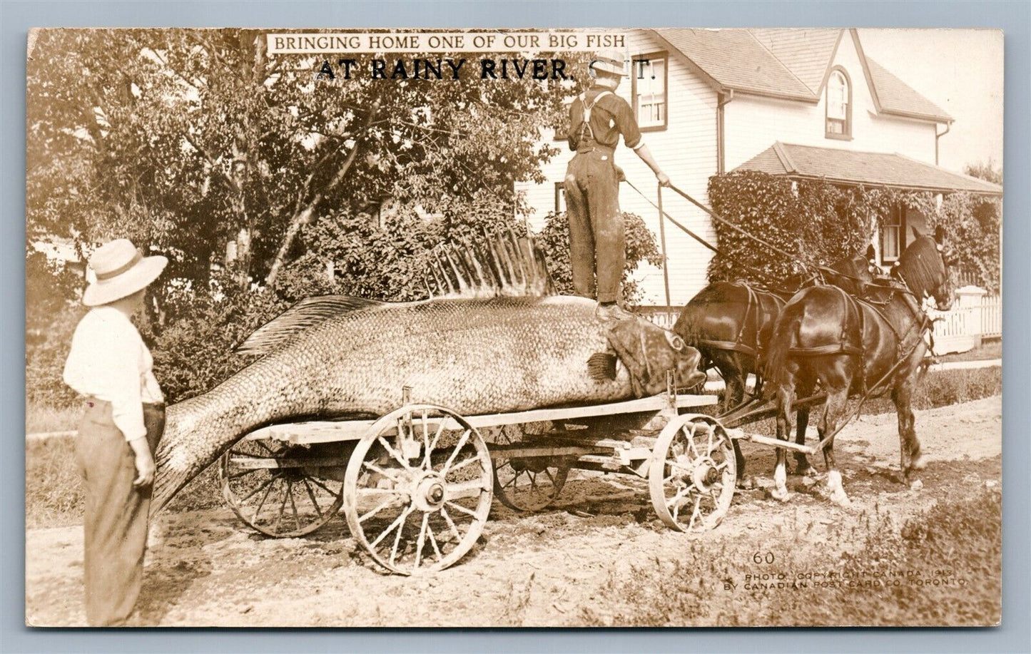 EXAGGERATED FISH BRINGING HOME ANTIQUE REAL PHOTO POSTCARD RPPC fishing