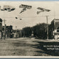 PHOTOMONTAGE AIRPLANES ZEPPELIN OVER HOPKINTON IA ANTIQUE REAL PHOTO PC RPPC