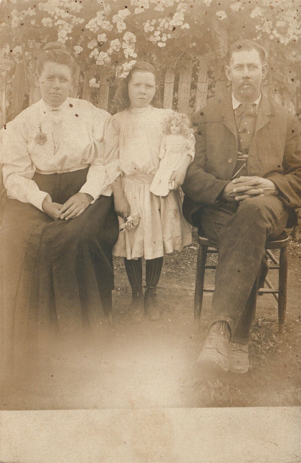 LITTLE GIRL w/ DOLL & PARENTS ANTIQUE REAL PHOTO POSTCARD RPPC