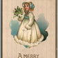 GIRL w/ FLOWERS CHRISTMAS ANTIQUE EMBOSSED POSTCARD