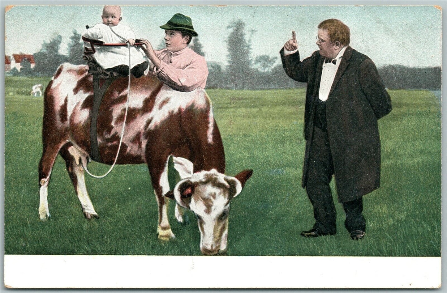 BABY COW RIDING ANTIQUE POSTCARD