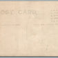 STUDIO PHOTO w/ EARLY CAR auto ANTIQUE REAL PHOTO POSTCARD RPPC