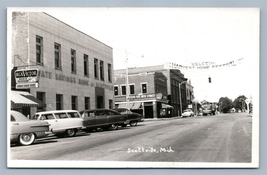 SCOTTVILLE MI STREET SCENE VINTAGE REAL PHOTO POSTCARD RPPC STATE SAVING BANK