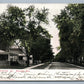 MONROE WI EAST WASHINGTON STREET 1907 UNDIVIDED ANTIQUE POSTCARD w/ CORK CANCEL