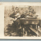 GERMAN WWI ERA SOLDIER w/ GUITAR & FLOWERS ANTIQUE REAL PHOTO POSTCARD RPPC