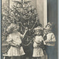 KIDS w/ TOYS UNDER CHRISTMAS TREE ANTIQUE GERMAN REAL PHOTO POSTCARD RPPC