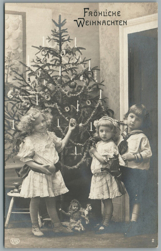 KIDS w/ TOYS UNDER CHRISTMAS TREE ANTIQUE GERMAN REAL PHOTO POSTCARD RPPC