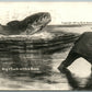 EXAGGERATED FISHING 1911 ANTIQUE REAL PHOTO POSTCARD RPPC NIP + TUCK w/ A BASS