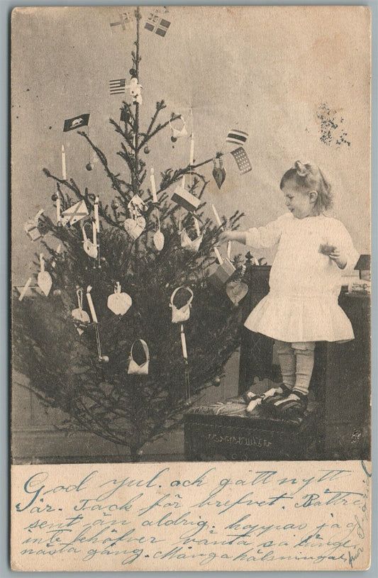 LITTLE GIRL DECORATING CHRISTMAS TREE ANTIQUE POSTCARD