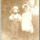 FACE MASK BOY w/ A BEARD & GIRL ANTIQUE RPPC REAL PHOTO POSTCARD