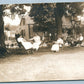 RELAXING ON THE BACK YARD ANTIQUE REAL PHOTO POSTCARD RPPC