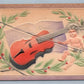 VALENTINE ANTIQUE EMBOSSED POSTCARD CUPID w/ VIOLIN & MUSIC NOTES