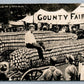 EXAGGERATED CORN COUNTY FAIR ANTIQUE REAL PHOTO POSTCARD RPPC