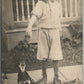 BOY FEEDING HIS DOG ANTIQUE REAL PHOTO POSTCARD RPPC