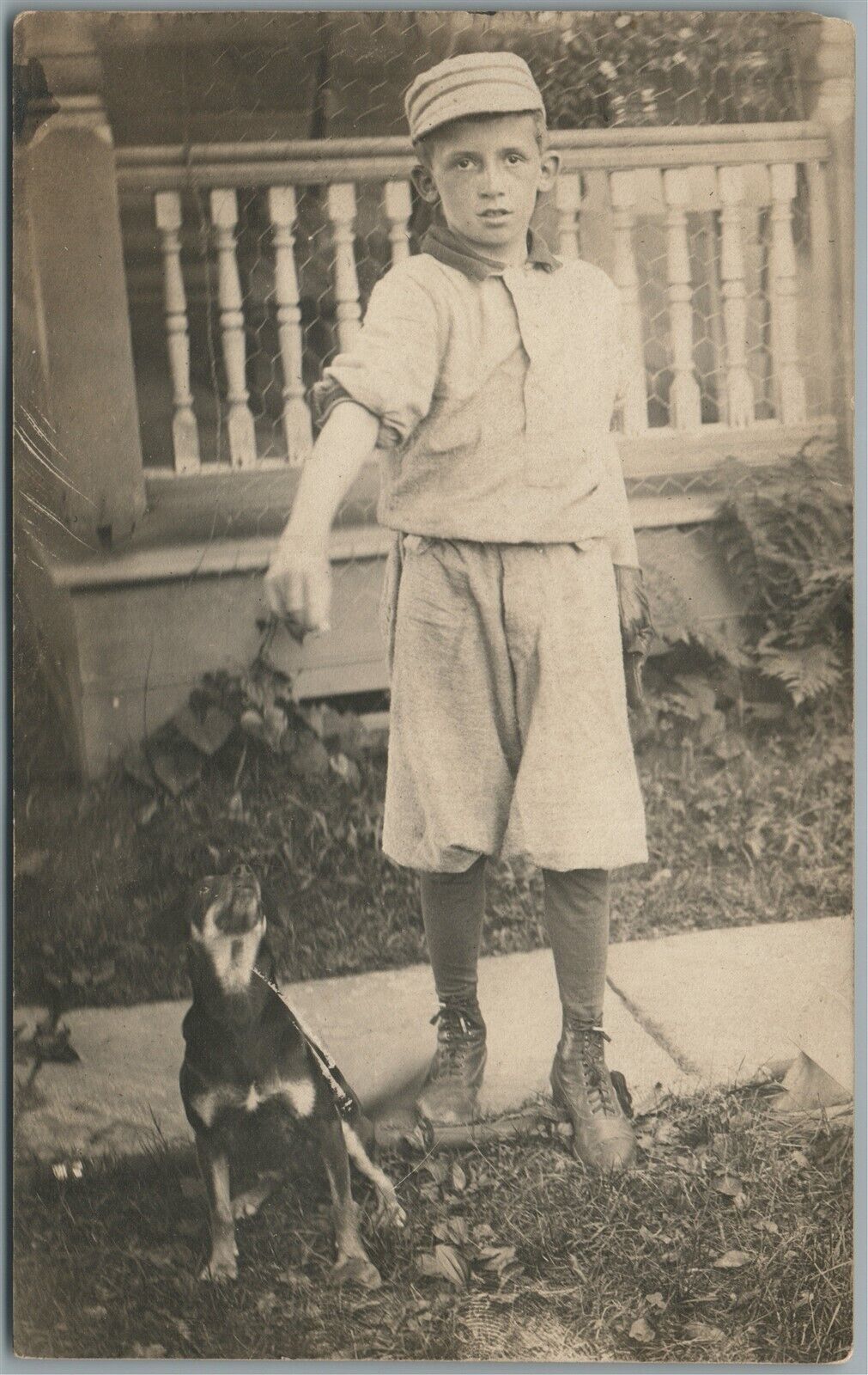 BOY FEEDING HIS DOG ANTIQUE REAL PHOTO POSTCARD RPPC