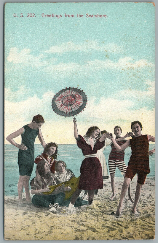 PLAYING ON THE BEACH ANTIQUE POSTCARD