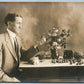 ROMANTIC MAN w/ FLOWERS AND WALNUTS ANTIQUE REAL PHOTO POSTCARD RPPC