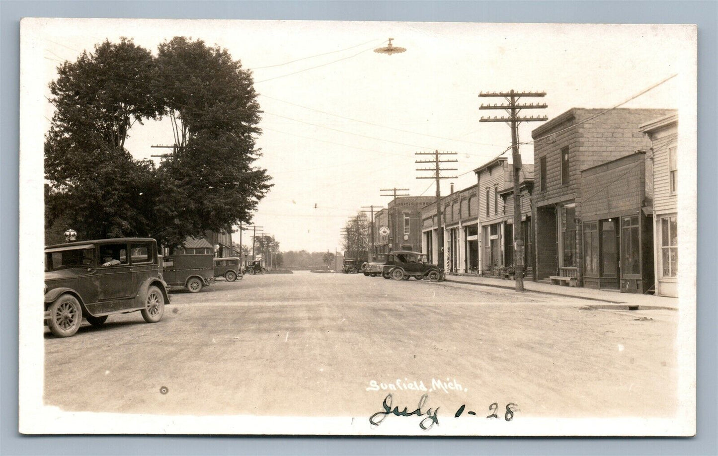 SUNFIELD MI ANTIQUE REAL PHOTO POSTCARD RPPC STREET VIEW GASOLINE SALES SIGN