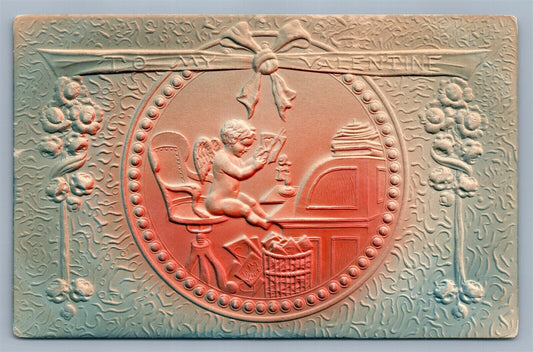 VALENTINE EMBOSSED ANTIQUE POSTCARD CUPID READING LETTERS