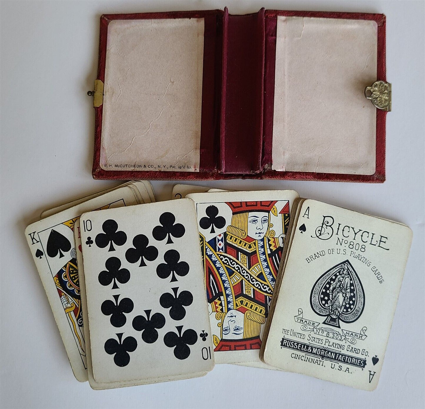 1890s BICYCLE THISTLE BACK ANTIQUE PLAYING CARDS RUSSELL & MORGAN BOOK SHAPE