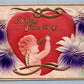 VALENTINE EMBOSSED ANTIQUE POSTCARD CUPID w/ ARROW & RED HEART