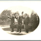 WELL DRESSED TRAVELERS ANTIQUE REAL PHOTO POSTCARD RPPC