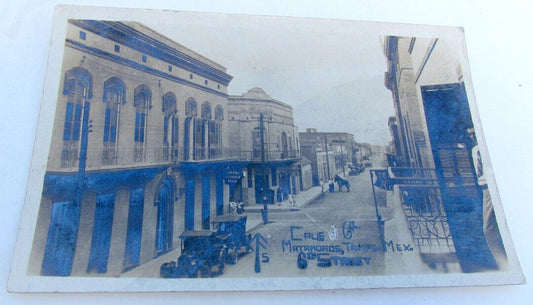 RPPC VINTAGE PHOTO POSTCARD Matamoros Tamaulipas MEXICO STREET OLD CARS & SIGNS