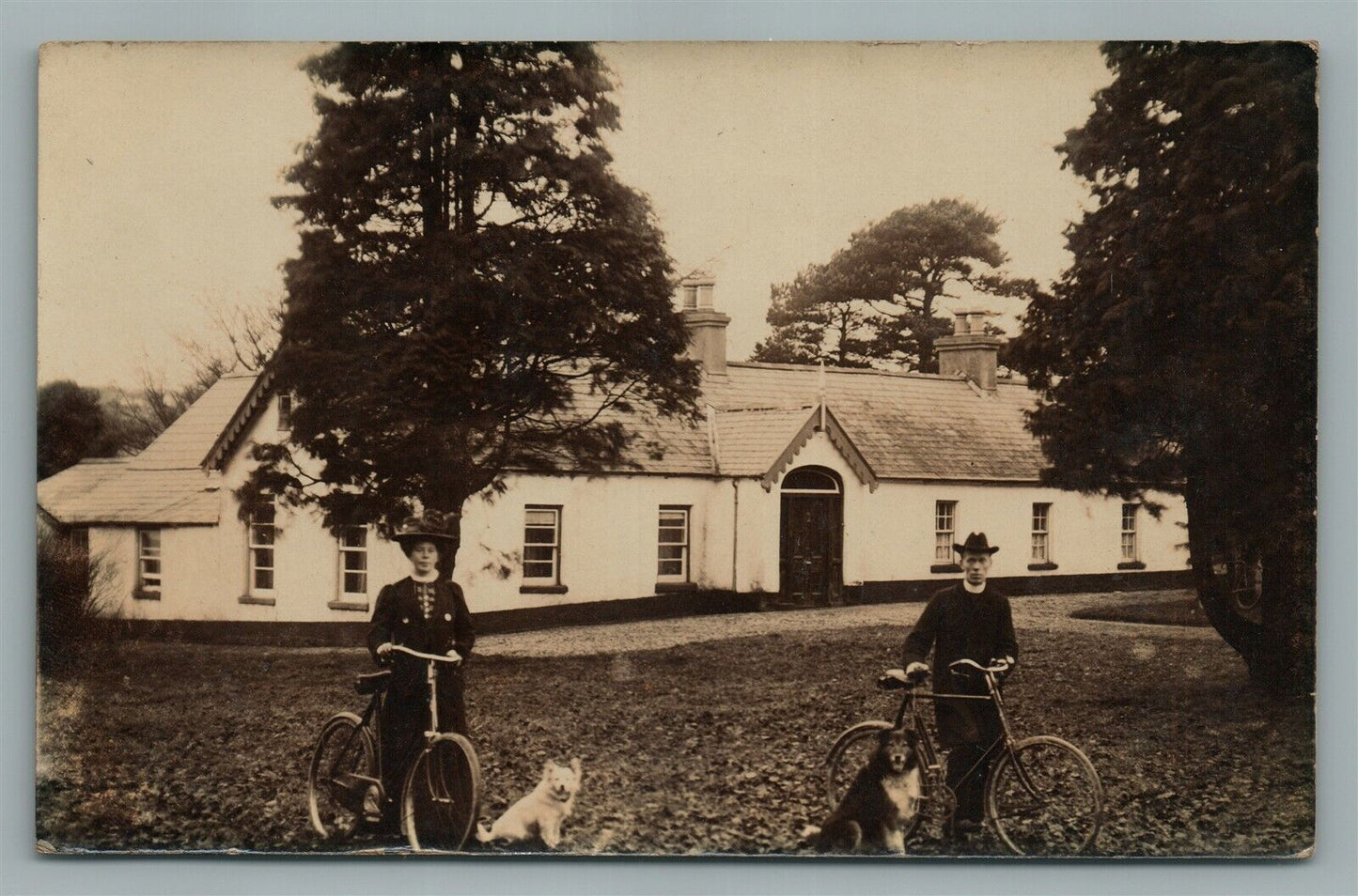 COUPLE ON BICYCLES w/ DOGS ANTIQUE REAL PHOTO POSTCARD RPPC