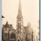 CITY STREET SCENE w/ CHURCH ANTIQUE REAL PHOTO POSTCARD RPPC