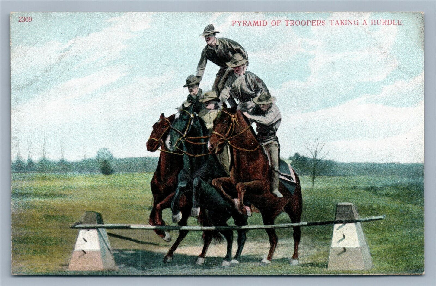 PYRAMID OF TROOPERS TAKING A HURDLE ANTIQUE WWI POSTCARD