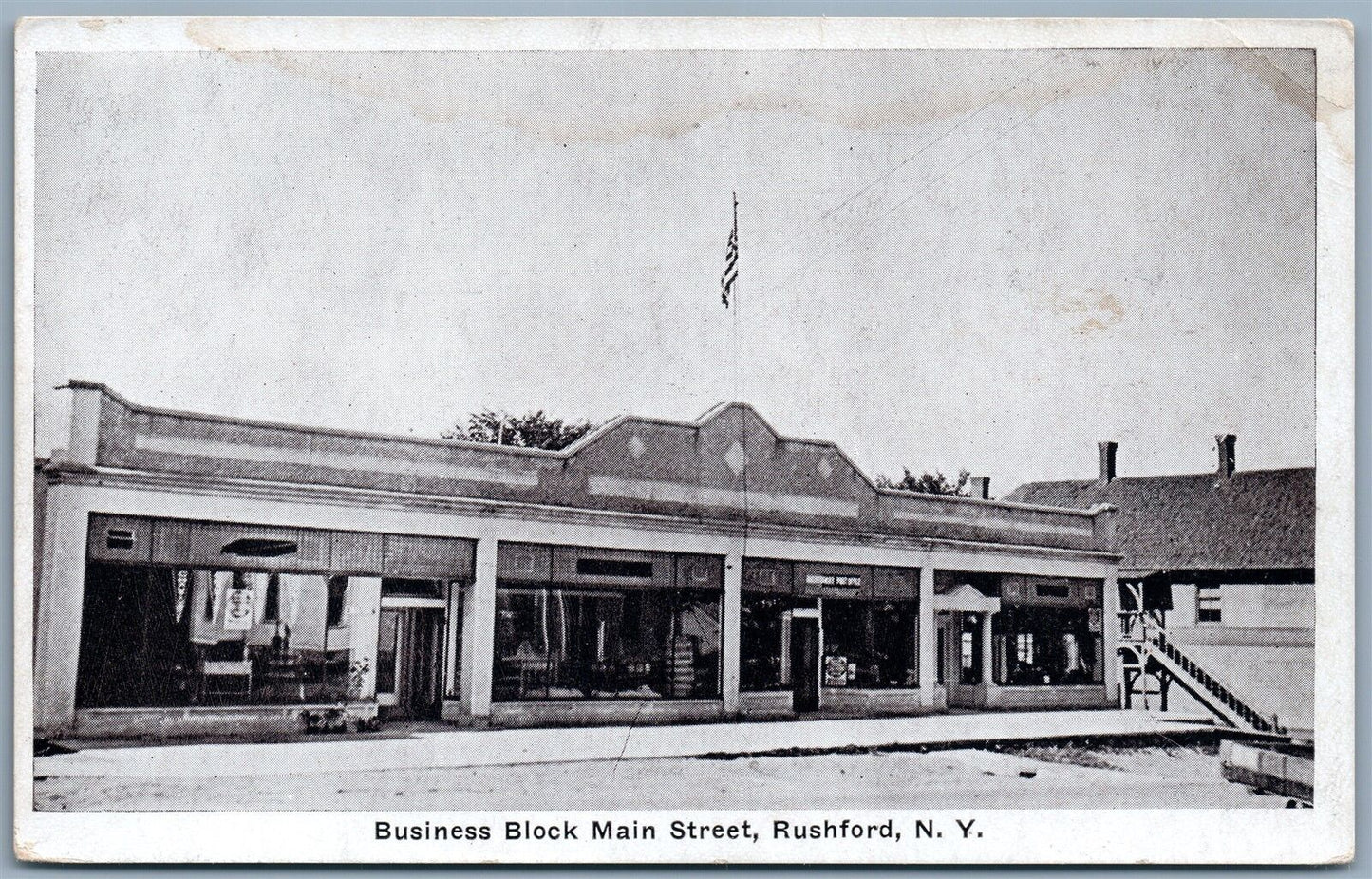 RUSHFORD NY BUSINESS BLOCK MAIN STREET ANTIQUE POSTCARD