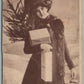 LADY w/ CHRISTMAS GIFTS ANTIQUE POSTCARD