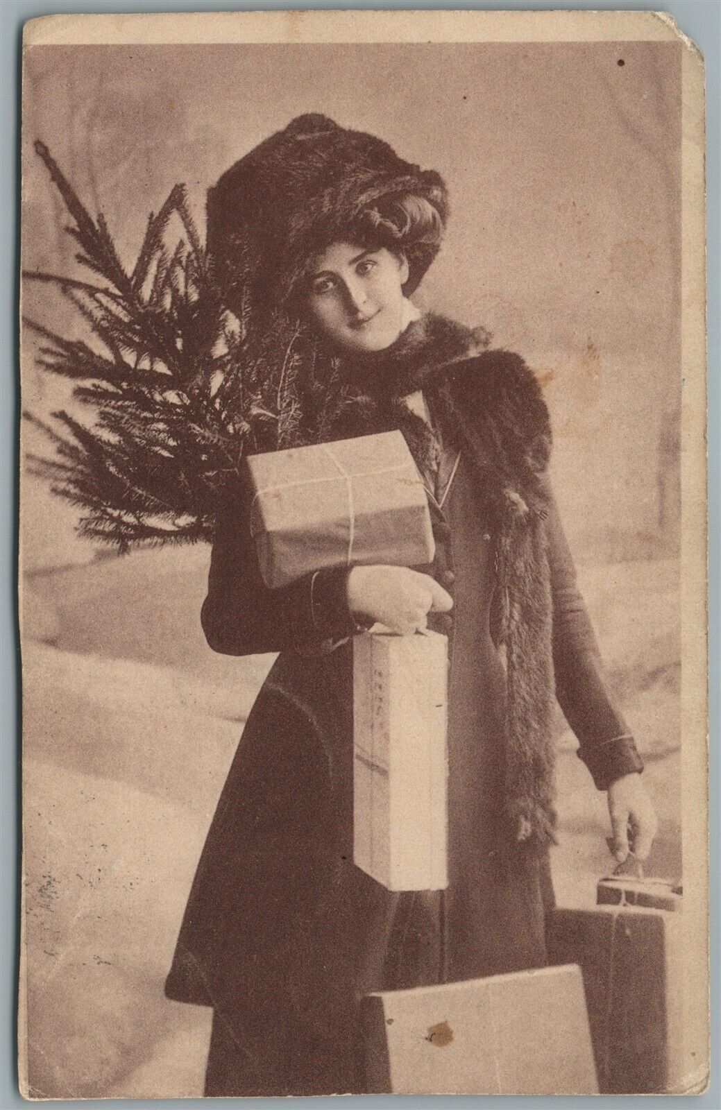 LADY w/ CHRISTMAS GIFTS ANTIQUE POSTCARD