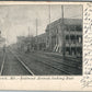 CUMBERLAND MD BATLTIMORE STREET FROM RAILROAD CROSSING ANTIQUE POSTCARD